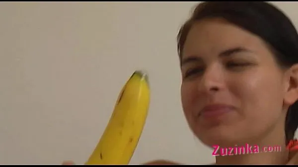 Big How-to: Young brunette girl teaches using a banana warm Tube