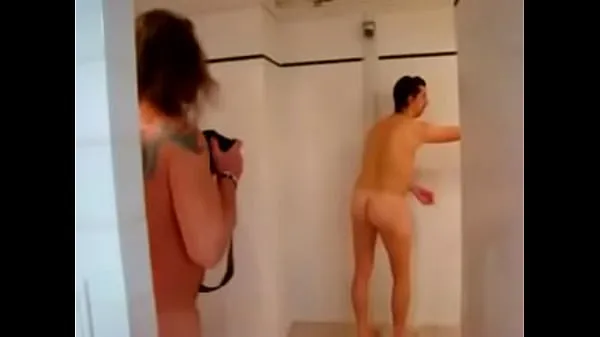 Naked rugby players get touchy feely in the showers أنبوب دافئ كبير