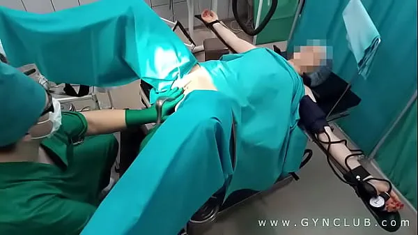 Big Gynecologist having fun with the patient warm Tube