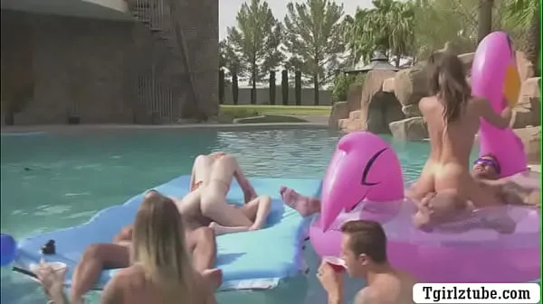 Big Busty shemales are in the swimming pool with many guys that,they decide to do orgy and they start kissing each is,they suck their big cocks passionately and they let them bareback their wet ass too warm Tube