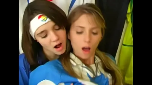 Big Girls from argentina and italy football uniforms have a nice time at the locker room warm Tube