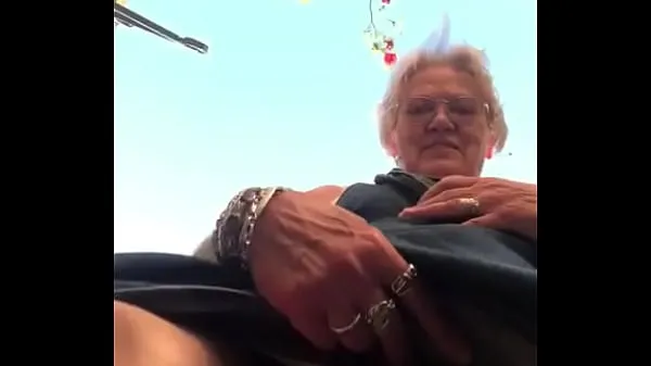 Big Grandma shows big slit outside warm Tube