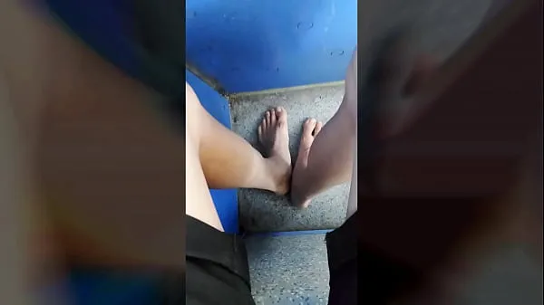 Big Jon Arteen walks barefoot on the street outdoors, the boy is barefoot in the crowded tram to the town center warm Tube